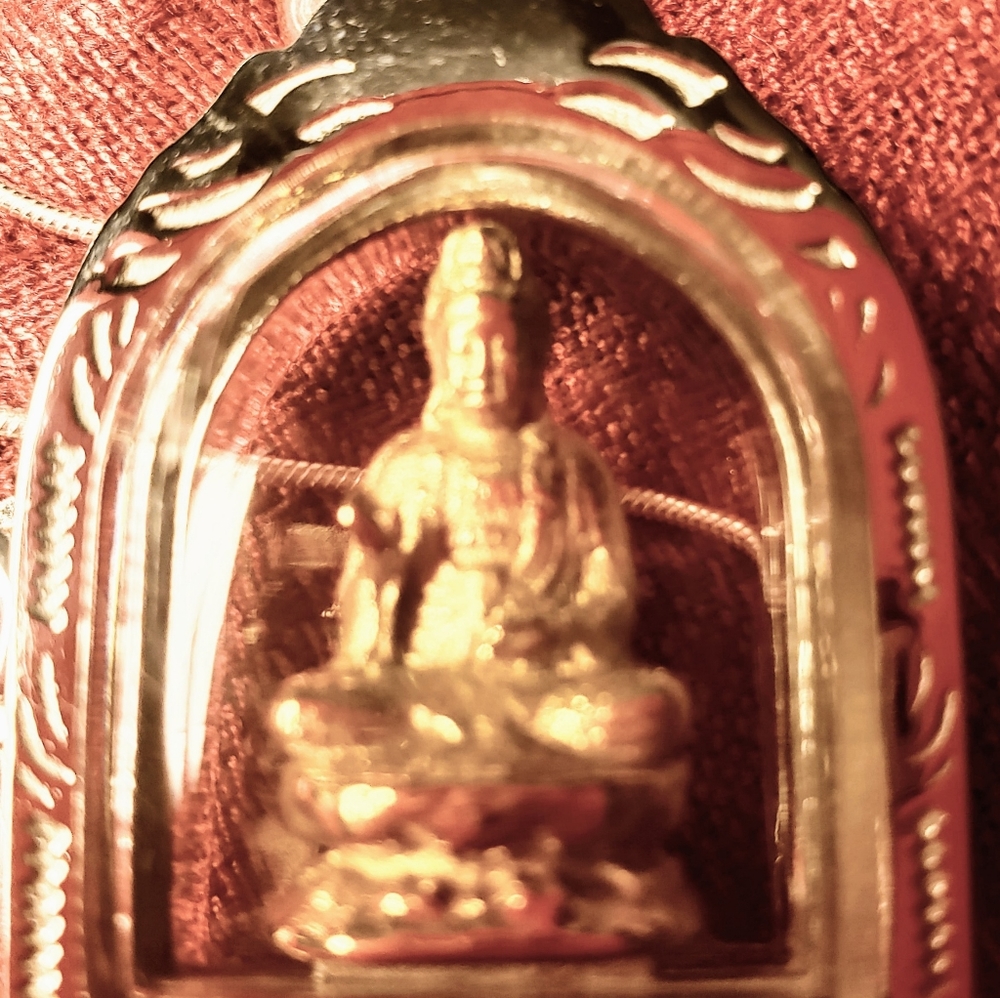 Temple of Quan Yin clear glass sanctuary necklace. She sits on a gold th…